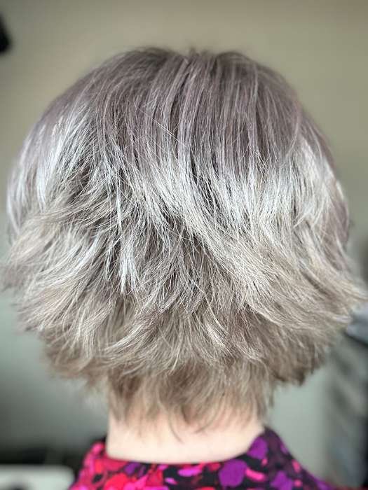 Back view of a textured layered bob short silver wig for women showing tousled natural shine