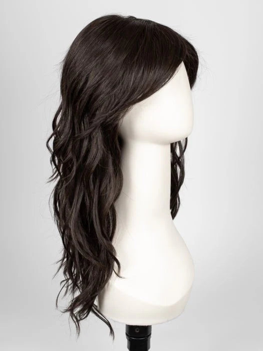 long wavy brown wig for women on mannequin with side swept bangs and layered cascading waves