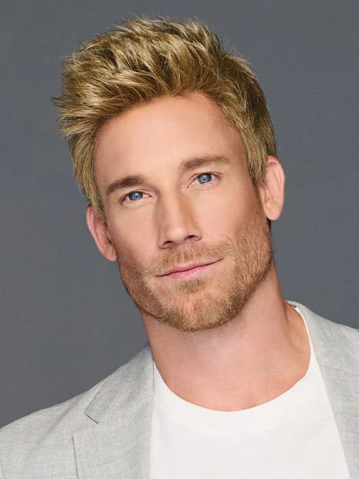 Male model wearing HairUWear Dapper HIM wig for men. Short textured blonde style with light stubble and gray blazer