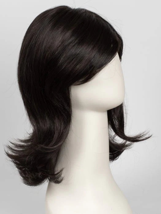 Mannequin wearing Raquel Welch Goddess wig in dark brown shoulder length layered style with flipped ends and side bangs