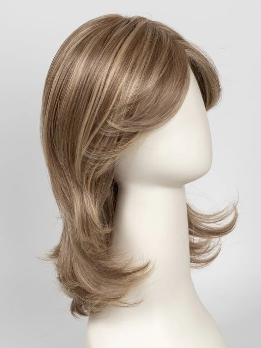 Raquel Welch Goddess wig light brown layered shoulder length with soft feathered ends on mannequin