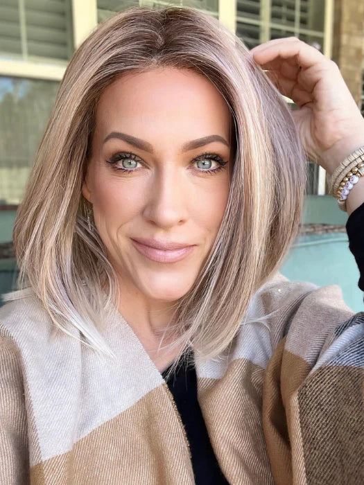 Model wearing Ellen Wille Drive wig shoulder length ash blonde bob with middle part and natural hairline