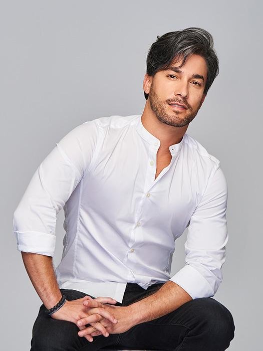 Male model wearing Gallant HIM wig for men by HairUWear in dark salt and pepper side swept style with natural texture