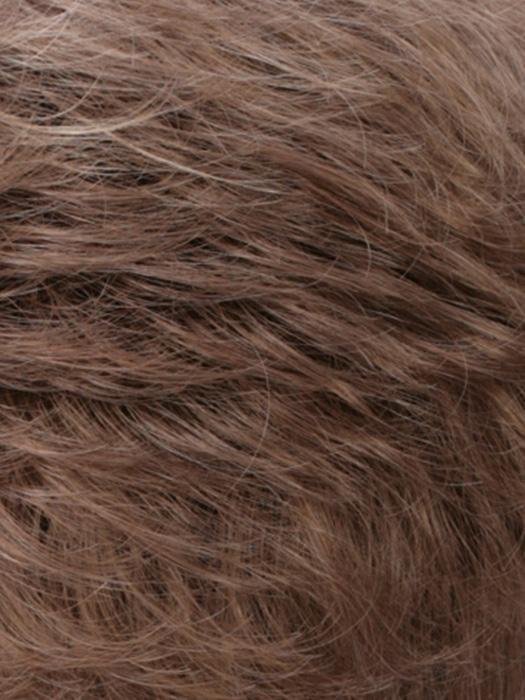 Close-up of a natural-looking human hair wiglet for thinning hair in soft brown tones