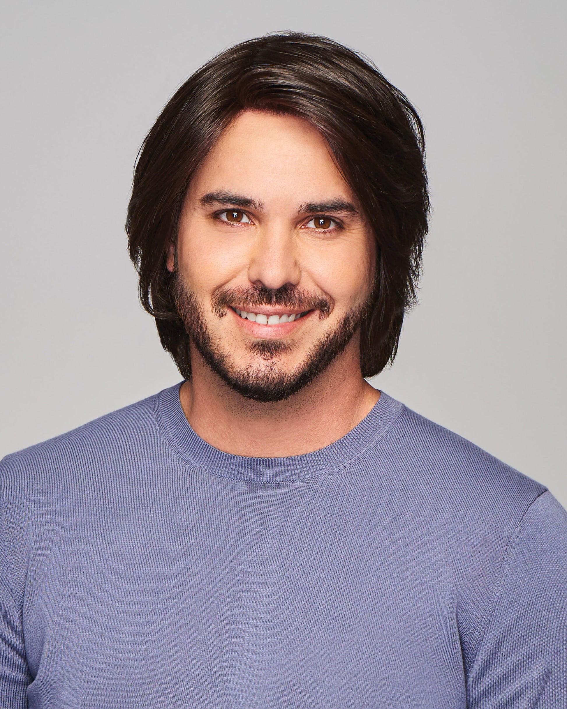 Sharp HIM wig for men by HairUWear medium brown layered style with natural texture on smiling male model