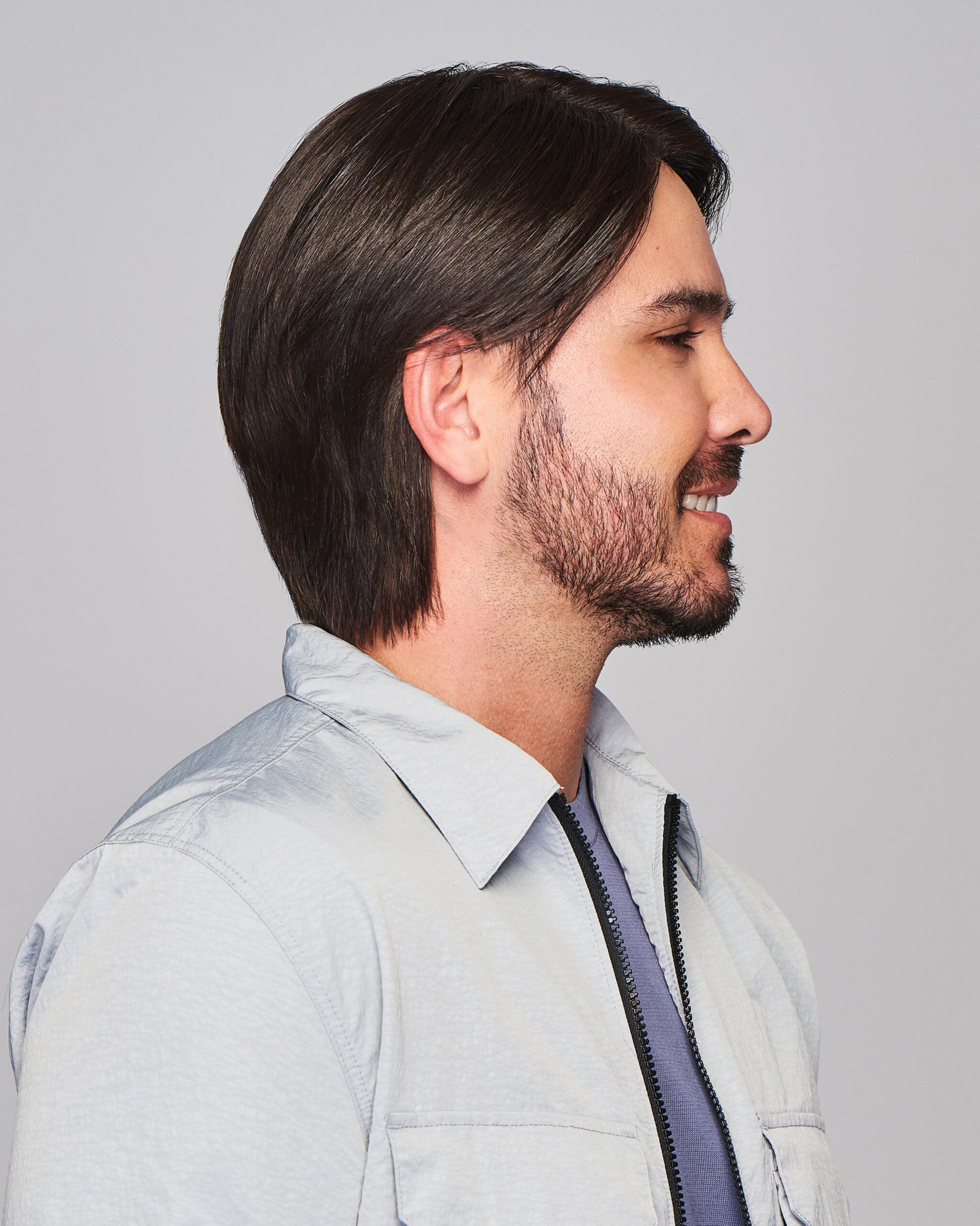 Sharp HIM wig for men on model side profile dark brown medium length natural looking hair with beard