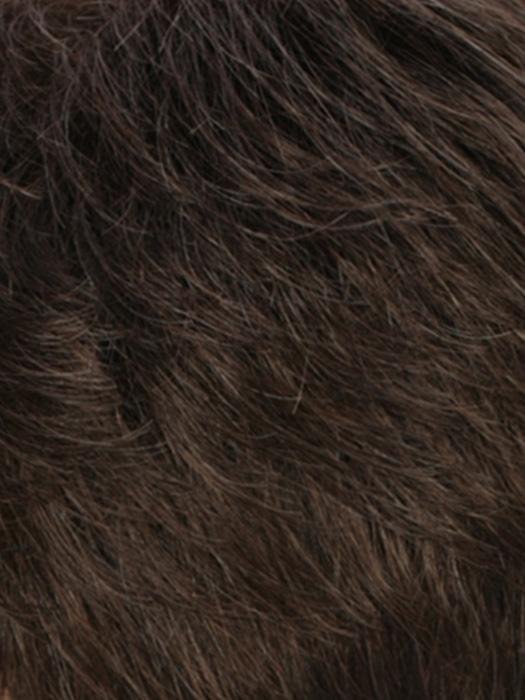 Close-up of a dark brown monofilament hair topper for thinning hair with natural texture