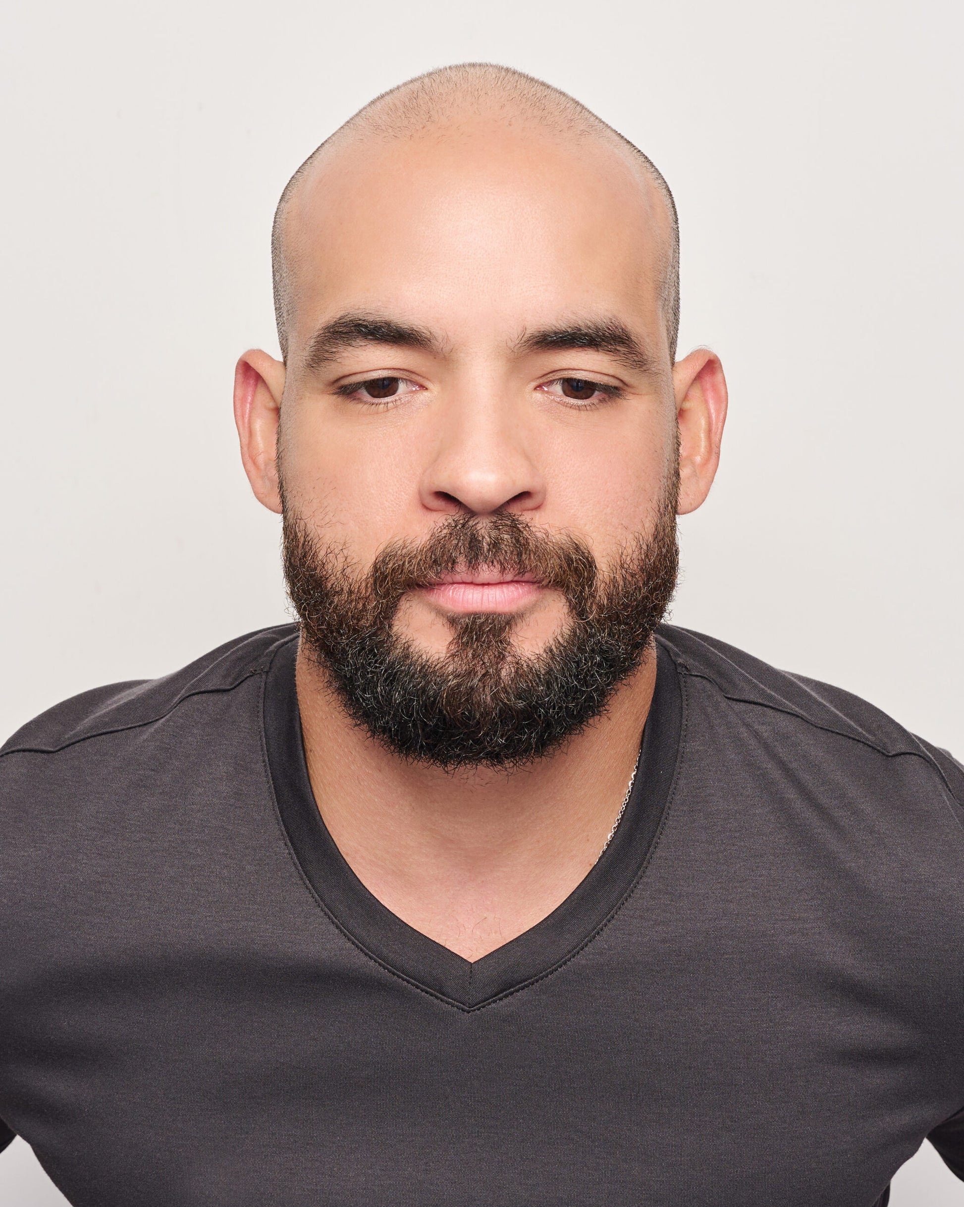 Admirable HIM wig for men HairUWear natural looking hairpiece shown on bearded man with shaved scalp